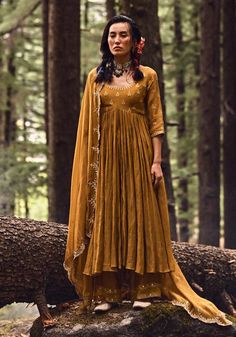 Editor's Note Our 20 Kali Ochre Yellow Anarkali Is Beautifully Handcrafted With Mirrors And Resham Thread Work Paired With Hand Highlighted Dupatta And Pants Color: Ochre Yellow Fabric: Malai Chanderi Care: Dry Clean Only About the Designer Paulmi & Harsh is a luxury prêt label inspired by beautiful botanicals. Paulmi & Harsh design strong, feminine silhouettes with prints and delicate detailing, fusing 1950’s fashion with modern-day sensibilities. Paulmi & Harsh are obsessed with the little det Yellow Anarkali, Blouse Yoke, 1950’s Fashion, Personal Shopping Service, Ochre Yellow, Yellow Fabric, Thread Work, Pants Color, Personal Shopping