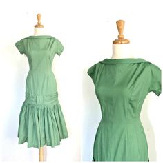 Vintage 1960s green cocktail dress. Drop waist silhouette. Full skirting with attached tulle for fullness. Pleated skirt and sash accent. Metal back zipper closure. Vertical seams add dimension and shape to dress. Additional fabric, measurement and condition information provided for your consideration. Maker: - Fabric: Estimated to be cotton, light medium weight, no stretch, very light sheen to fabric. Tulle is estimated to be polyester. Condition: Dress is in Good Vintage Condition (scale: Mint 1950s Style Green A-line Dress, Green Retro Cocktail Dress, 1950s Fitted Knee-length Vintage Dress, 1950s Style Fitted Knee-length Vintage Dress, Fitted 1950s Knee-length Vintage Dress, Fitted 1950s Style Dresses For Vintage Events, Fitted Knee-length 1950s Vintage Dress, 1950s Style Green Evening Dress, Green 1950s Style Evening Dress