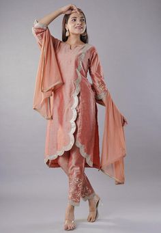 Readymade Cotton Silk Pakistani Suit in Peach color. This attire with Cotton Lining is Enhanced with Zari, Sequins and Stone Work. Crafted in Notched Round Neck and Quarter Sleeve. Available with a Cotton Silk Pant and a Faux Chiffon Dupatta in Peach color. The Kameez and Bottom Lengths are 44 and 38 inches respectively.   Do note: 1.)Accessories shown in the image are for presentation purposes only and length may vary upto 2 inches. 2.)Slight variation in actual color vs. image is possible.   W Party Wear Dresses Indian, Indian Party Wear Dresses, Pakistani Sharara, Wedding Outfits Indian, Vs Image, Latest Salwar Suits, Readymade Salwar Kameez, Latest Salwar Kameez, Silk Pant