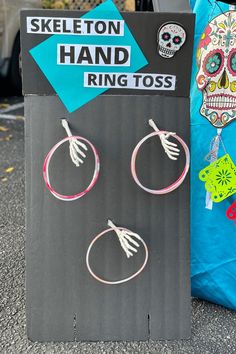 skeleton hand ring tossers are on display outside