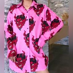 This Casual Loose Style Is An Unisex Devil Print Shirt That Will Pair With Jeans And Under Crop Tops! Great For This Time Of The Year!! Brand New With Tags Measurements Length Approx 30” Pit To Pit Approx 24.5” Shoulder To Shoulder Approx 21” Arm Length Approx 23” This Shirt Is To Use As An Oversized Clothing Or Very Loose Style Trendy Pink Button-up Top, Pink Graphic Print Button-up Top, Pink Printed Button-up Shirt, Trendy Pink Collared Top, Pink Printed Shirt For Fall, Pink Collared Shirt With Buttons, Pink Collared Shirt For Fall, Casual Pink Blouse With Graphic Print, Pink Long Sleeve Blouse With Graphic Print