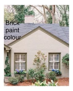 a white house with green shutters and plants in the front yard, next to it is an advertisement for brick paint color