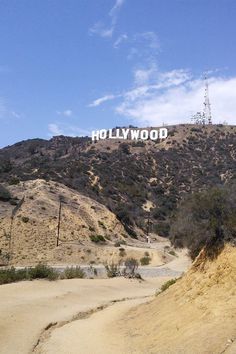 the hollywood sign is on top of a hill