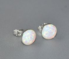 Shop Opal Stud Earrings, White Opal Earrings Sterling Silver , 8mm Opal, Bridesmaid Gift, Bridal Opal Jewelry, Gift For Her I made these white opal earrings with: - Gorgeous multicolored lab created round opal cabochons-8 mm - Solid 925 sterling silver bezels with a post You'll get sterling silver stoppers and silicone backs. Created opals are actually preferred to natural opals for many jewelry items. Natural opal is not particularly well-suited to being used in many jewelry applications since Silver Round Earrings For Bridesmaid Gift, White Round Earrings For Bridesmaid Gift, White Round Earrings For Bridesmaids, White Round Bridal Earrings For Bridesmaid Gift, White Round Bridal Earrings For Bridesmaid, White Bridal Earrings For Bridesmaid Gift, White Sterling Silver Earrings For Bridesmaid Gift, Hypoallergenic White Round Bridal Earrings, White Opal Earrings