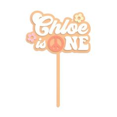 a cake topper that says gloe is one with flowers on it and the word peace