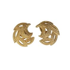 These vintage Crown Trifari clip-on earrings are a stylish addition to any jewelry collection. The gold tone base metal gives them a classic feel, while the brand name adds a touch of elegance. The clip-on closure ensures they can be worn comfortably by anyone without the need for pierced ears. 1" h by 0.75"w by 0.25" D    Perfect for a night out or to add a touch of glamour to an everyday outfit, these Trifari earrings are a must-have for vintage jewelry enthusiasts. Gold-tone Brass Clip-on Earrings For Formal Occasions, Vintage Gold Plated Clip-on Earrings For Formal Occasions, Retro Gold Brass Earrings, Vintage Yellow Gold Plated Clip-on Earrings, Retro Yellow Gold Metal Earrings, Gold Metal Clip-on Earrings For Formal Occasions, Vintage Yellow Gold Clip-on Hoop Earrings, Vintage Yellow Gold Metal Clip-on Earrings, Vintage Gold-plated Clip-on Earrings