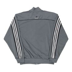 Description:Vintage grey Adidas track jacket, fits large.GENDER: mens CONDITION: good - stains on front and sleeves.STYLE: track jacketERA: 1990sCOLOUR: greyFABRIC: polyester Urban Gray Track Jacket For Streetwear, Gray Track Jacket For Streetwear In Fall, Gray Track Jacket For Fall Streetwear, Gray Sportswear Track Jacket For Fall, Gray Athleisure Track Jacket For Streetwear, Gray Long Sleeve Sportswear Track Jacket, Adidas Track Jacket, Sleeves Style, Jacket Fits