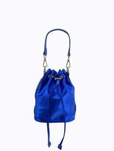 Luxe satin drawstring bucket bag with short detachable faux leather strap, plus additional long adjustable PL branded webbing strap. Silver hardware throughout plus hidden zipper pocket in lining.Bag Measures:Height: 20cmWidth: 19cmDepth: 9.5cmStrap Drop (short): 15cmStrap Drop (long/adjustable): 36-66cm Luxury Bucket Bag With Zipper Closure, Luxury Blue Bucket Bag With Adjustable Strap, Evening Bucket Shoulder Bag With Zipper, Evening Shoulder Bucket Bag With Zipper, Evening Bucket Bag With Zipper Closure, Evening Shoulder Bucket Bag With Zipper Closure, Evening Satchel Bucket Bag With Adjustable Handle, Blue Travel Bag With Long Strap, Blue Bags With Long Strap For Travel