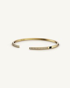 A Bangle in 14k gold plated 316L stainless steel from Waldor & Co. One size. The model is Acme Bangle Polished. White Dial, Gold Set, 22k Gold, Diamond Cut, Free Size, Diamond Cuts, Gold Plate, Bangles, Water Resistant