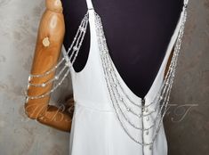 Material: Imitation Pearl，glass crystal Shoulder chain: one pair of 3-layer pearl chains.  Back chain: one  4-layer pearl chains.  Shoulder and back chain set: one pair of 3-layer pearl chains and one 4-layer pearl chain.   Pearl chains are customizable.  If you need to change the length, please contact me.  Thank you Party Pearl Backdrop Necklace With Adjustable Chain, Silver Pearl Drop Backdrop Necklace For Party, Party Silver Backdrop Necklace With Pearl Drop, Silver Backdrop Necklace With Pearl Drop For Party, Silver Chain Body Jewelry For Wedding, Pearl Chain Dangle Backdrop Necklace, Silver Beaded Bridal Necklace For Wedding, Silver Beaded Chain Bridal Necklace For Wedding, Pearl Backdrop Necklace With Adjustable Chain For Parties