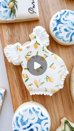 decorated cookies with blue and yellow designs on them