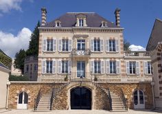 a large building with many windows and stairs