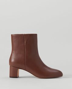 Elevate your style with the Ann Taylor Block Heel Leather Bootie, a perfect blend of luxury and comfort. These booties feature a sophisticated pebble brown leather that complements any outfit.

- Size: 7 1/2
- Color: Pebble Brown
- Material: Leather
- Gender: Female
- Heel Height: 2 1/4 inches
- Design: Pointy toe with an inside zip
- Comfort: Padded footbed for enhanced comfort

Crafted for the modern woman, these booties are designed to provide both style and comfort. The block heel offers sta Female Features, Brown Booties, Extra Mile, Leather Block Heels, Shoes Booties, Petite Fashion, Leather Booties, Leather Fashion, New Shoes