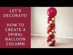 a balloon column with gold and red balloons on it, in the middle of a room