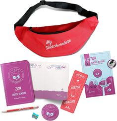 a red fanny bag with some stickers and other items around it on a white surface