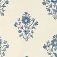 a blue and white wallpaper with flowers on it