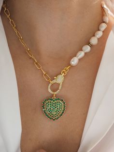 Freshwater gold chunky necklace Length is  40cm/16''  but you can choose other length from the drop down menu     This  necklace made half  from freshwater pearl Gold  chain  and  the other half from gold lik chain  In the middle of this  hangs one green micropave zirgon heart   It is incredibly elegant jewelry  , that you can wearing it non stop with all of your outfits. Also  it is  a perfect long distance gift for her to express your love.   How to wear : With white Shirt V neck * Please note that   product colour may vary from colors shown on your monitor. *This Listing is only for one necklace purchase. * * *Gift wrapping and packaging All orders come gift wrapped into a cute metatilic round box .If you have ordered more than one item will be wrapped all together unless you advise me Gold Plated Chain Pearl Necklace As Gift, Chunky Chain Heart Pendant Necklace As Gift, Chunky Chain Heart Pendant Necklace For Gift, White Pearl Necklace With Chunky Chain For Gift, Chunky Chain Heart Pendant Jewelry Gift, Gift Pearl Pendant Necklace With Lobster Clasp, Gift Pendant Pearl Necklace With Lobster Clasp, Pendant Pearl Necklace With Chain As Gift, Green Chunky Chain Necklace As Gift