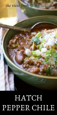 two bowls filled with chili and meat on top of a table