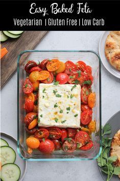 tomatoes, cucumbers, and other vegetables in a glass dish on a table