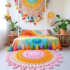 a bed with colorful crocheted bedspread and decorations on the wall above it