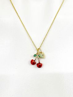 This is gold tone cherry charm with hand stamped initial charm on brass/stainless steel 18 inches chain. ♥ You will receive 1 necklace. HOW TO ORDER 1) Select the quantity 2) Select the initial  3) Add to cart DESCRIPTION ♥ Necklace, Gold Plated over Brass or Stainless-steel Cable Chain with Lobster Claw Clasp, Size: about 17.7 inches (45cm) long, 1-2mm wide, Nickel Safe, ♥ Initial Charms, Gold Plated over Stainless steel, Size: about 8-10mm in diameter, 1mm thick, Nickel Safe, ♥ Cherry Charm, Alloy Enamel Pendant, Size: about 0.585 inch(15mm) wide, 0.585 inch(15mm) long. PLEASE READ: ♥ Raw materials from the USA and international sourcing. ♥ I do not include invoices in any packages unless requested. ♥ Handmade to order, please allow 2-5 days for us to make your item before shipping, ♥ Je Dainty Red Personalized Charm Necklaces, Dainty Personalized Red Charm Necklaces, Cherry Colored Vintage Jewelry For Gifts, Vintage Cherry Jewelry For Gift, Cherry Colored Vintage Jewelry For Gift, Cherry Vintage Jewelry For Gift, Vintage Cherry Colored Jewelry Gift, Red Nickel-free Charm Necklace For Gift, Cherry Charm