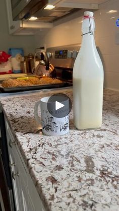 a bottle of milk sitting on top of a kitchen counter