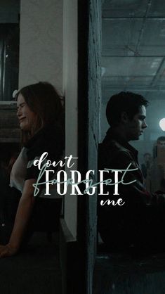 a man and woman sitting next to each other in front of a wall with the words don't forget one