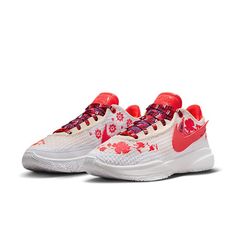 the nike air zoom flyknit 2 is decorated with red and white flowers