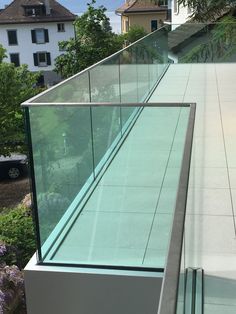 a glass railing on the side of a building