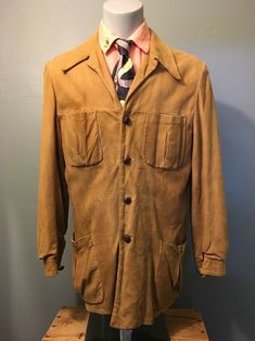 Preowned vintage men’s, 1940s-1950s, unique and sporty, tan, suede-leather deerskin, rockabilly, Elvis Ricky, Country-Gentleman, Hollywood Hep-Cat, leisure sport coat jacket. Classic retro old-school hunting fishing, racetrack, horseback riding, resort-attire, blazer featuring 4 vented pouch pockets. Worn, lining replaced, buttons and belt removed from back, damage upper back right sleeve, a few spots, wear to cuff edges and button area, slight fade, otherwise, good condition, see pics. Label an Retro Single-breasted Blazer For Semi-formal Events, Retro Single-breasted Blazer For Semi-formal Occasions, Retro Sport Coat With Button Closure For Formal Events, Retro Sport Coat With Button Closure For Formal Occasions, Retro Formal Sport Coat With Button Closure, Retro Fitted Sport Coat For Fall, Fitted Retro Sport Coat For Fall, Vintage Sport Coat With Welt Pockets For Work, Vintage Notch Lapel Sport Coat For Fall