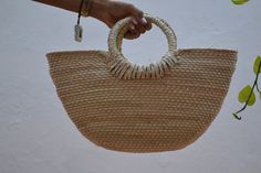 FREE SHIPPING IN USA Handmade bag with palm leaves. Perfect summer bag: for the beach, a picnic in the park or to wear your favorite outfit ... very versatile, with all the summer style. This bag is handwoven in Mexico from sustainable palm leaves decorated with unique applications. Materials: palm leaves. Please note that these bags are handmade, shapes and sizes may vary slightly. Summer Handheld Beach Bag In Natural Color, Summer Palm Leaf Bag For Market, Palm Leaf Bag For Beach Season And Market, Palm Leaf Bag For Beach Season Market, Summer Jute Bag With Round Handle, Eco-friendly Handheld Straw Beach Bag, Beach Season Market Bag Made Of Palm Leaf, Tropical Style Natural Color Bag For Vacation, Tropical Style Natural Color Vacation Bag