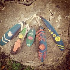 an instagram photo of colorful painted shoes on a tree stump with the caption earth children