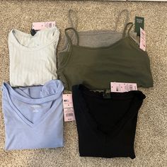 Wild Fable Shirts All Size Medium, All Brand New With Tags. Will Come With These 5 Shirts/Tank Tops. Includes: 1 Blue V-Neck Short Sleeved Shirt, 1 Black Short Sleeved Shirt, 1 Blue Short Sleeved Shirt With Open Back, 1 Gray Tank, And 1 Green Tank. No Damage Rips Or Tears. Never Been Worn Casual Loungewear Crop Top Camisole, Basic Camisole Tops For Loungewear, Trendy Camisole Top For Loungewear, Casual Layering Camisole Crop Top, Casual V-neck Crop Top For Layering, Basic Spring Camisole Tops, Basic Camisole Tops For Spring, Casual Camisole Top For Layering, Casual Camisole Tops For Loungewear