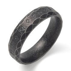 an oxen ring with the word love engraved on it's center and black diamond pattern