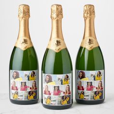 three bottles of champagne with pictures on them