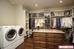 a washer and dryer are in the closet