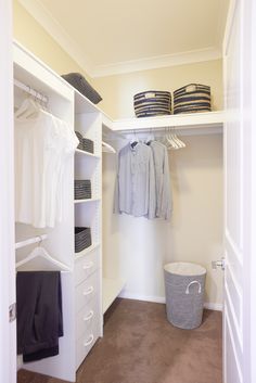 the closet is clean and ready to be used as a clothing storage area for clothes