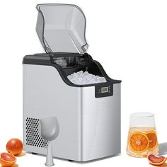 an image of a cooler with ice in it and oranges on the ground next to it