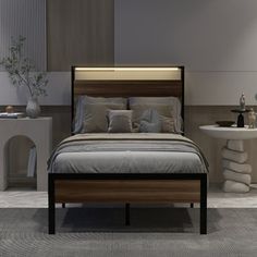 a bedroom with a bed, nightstands and two tables in the background at night