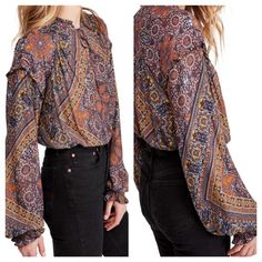 Hit Up The Festival Circuit Looking Like A Boho Queen In This Vibrant Top Fixed With A Casually Cool Split Neck And Ruffled Trim. 26 1/2" Length (Size Medium) Split Neck With Ties Long Sleeves With Elastic Cuffs 100% Polyester Machine Wash, Tumble Dry Questions? Leave A Comment Below! Brown Long Sleeve Peasant Top For Fall, Brown Long Sleeve Bohemian Blouse, Bohemian Long Sleeve Brown Blouse, Bohemian Brown Long Sleeve Blouse, Long Sleeve Peasant Top With Boho Print For Fall, Long Sleeve Boho Print Peasant Top For Fall, Multicolor Peasant Top For Fall, Brown Blouse With Blouson Sleeves, Casual Fall Peasant Top With Tie Neck