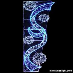 a lighted display with blue lights on it's sides and an image of a spiral staircase