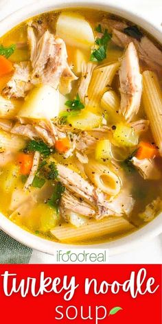 a bowl of turkey noodle soup with carrots and parsley