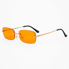 Add some fashionable function to your look with these sunglasses. These sunglasses have rectangle-shaped rimless lenses in super fun orange with red edges. The gold-tone accents add extra style. Frame color: Gold-tone Lens color: Orange Dimensions: 5.5" W x 1.5" H Material: Plastic - Claire's Orange Rectangle Rimless Sunglasses Rectangular Orange Sunglasses With Gradient Lenses, Orange Rectangular Sunglasses With Gradient Lenses, Modern Orange Rectangular Sunglasses, Rachel Core, Orange Y2k, Orange Glasses, 80s Glasses, Orange Accessories, Orange Sunglasses