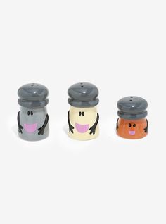 three salt and pepper shakers in the shape of cartoon characters with faces on them