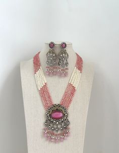 Pink Victorian Polki Kundan Necklace/Indian Long Necklace/Statement Necklace/Long Mala/Semi Precious Necklace/Rani Haar/Pakistani jewelry Kundan Mala Pendant Set With 2 Tone Plating Necklace Length = 21 Inch and adjustable Earrings length of 3.75 inches Kundan Pendant Set   Ships from California in 1 business day and delivery within 2-5 business days in the USA.  Color, shades, and texture displayed may vary slightly from the actual product due to digital image limitations. We request that you consider these minor variations. Please expect the possibility of some slight imperfections when buying handmade jewelry.  Please let me know if you have any questions. Arrives in a gift box. Thank you so much for visiting my shop. Traditional Pink Jewelry With Polished Beads, Silver Necklace With Cutdana Round Beads, Bollywood Style Beaded Chandbali Necklaces, Silver Beaded Necklace With Stone Work For Celebrations, Silver Beaded Necklaces With Stone Work For Celebration, Bohemian Stone Work Necklace For Celebrations, Bohemian Necklaces With Stone Work For Diwali, Pink Temple Jewelry Chandbali Necklace, Handmade Pink Necklace For Festive Occasions