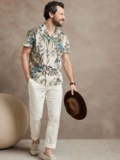 At once rugged and soft, this resort shirt is ideal for travel thanks to a luxurious, breathable cotton fabric and a camp collar for at-ease style.  Camp collar.  Button front.  Straight hem.  Unlined.  Standard fit.  Short sleeves.  Hip length.  Bod Formal Hawaiian Outfit For Men, Tommy Bahama Menswear, Tropical Outfit Men Casual, Mens Havana Nights Outfit, Tropical Attire Men, Resort Dinner Outfit Men, Beach Wedding Guest Outfit Men Casual, Island Cocktail Attire Men, Resort Cocktail Attire Men