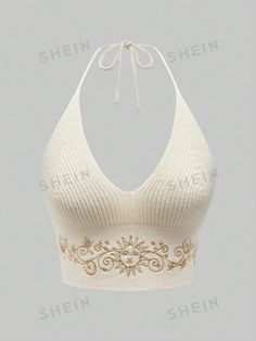 a woman's bra top with an embroidered design