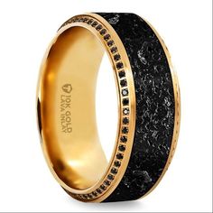 a black and gold wedding ring with black diamonds on the inside, set in 18k yellow gold