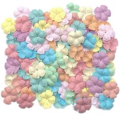 colorful paper flowers on a white background