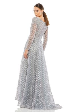 Long a-line formal gown with long sleeves and v-neckline. Mob Gowns, Brides Mom Dress, Sequin Ball Gown, Illusion Sleeves, Mom Dresses, Brides Mom, Gowns Couture, Mesh Gown, Elle Dress